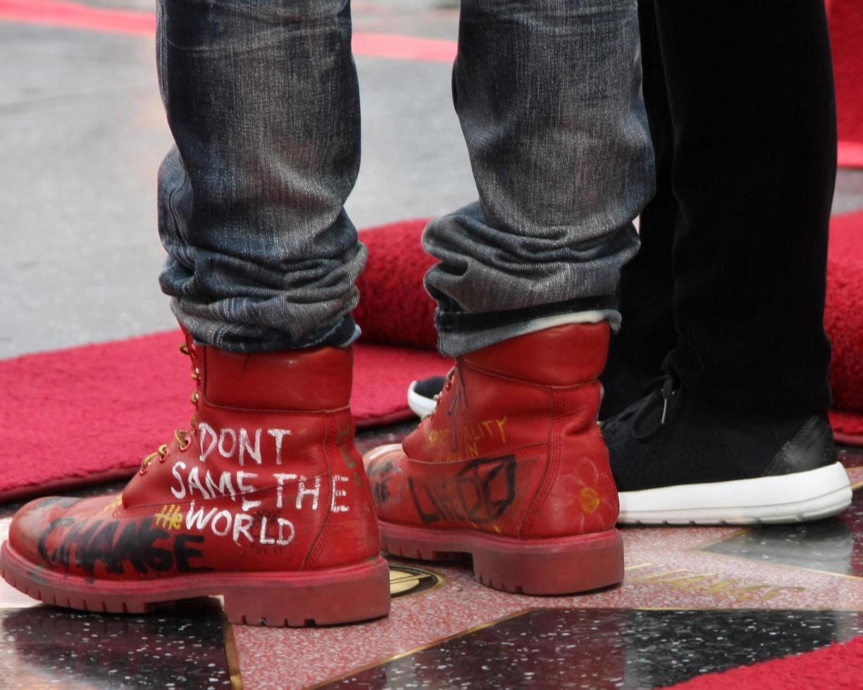LOS ANGELES, DEC 4 - Ellen DeGeneres, Pharrell Williams at the Pharrell Williams Hollywood Walk of Fame Star Ceremony at the W Hotel Hollywood on December 4, 2014 in Los Angeles, CA photo