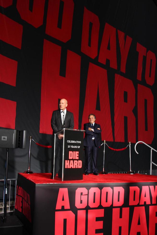 LOS ANGELES, JAN 31 - Bruce Willis, Jim Gianopulos at the A Good Day to Die Hard mural unveiling event at the 20th Century Fox Studios on January 31, 2013 in Los Angeles, CA. photo