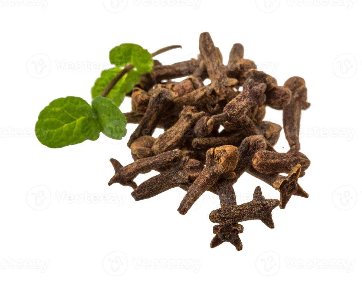 Cloves heap on white photo