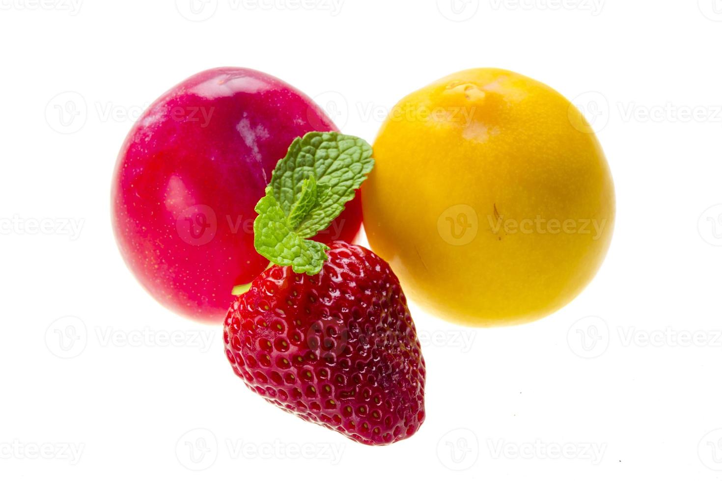 Bright ripe strawberry and plums photo