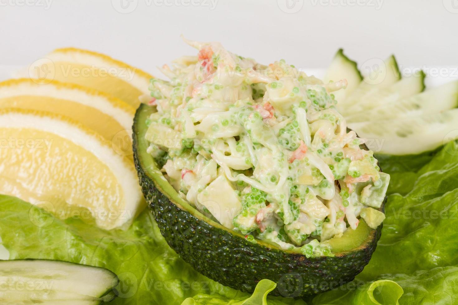 Crab meat salad with green caviar photo