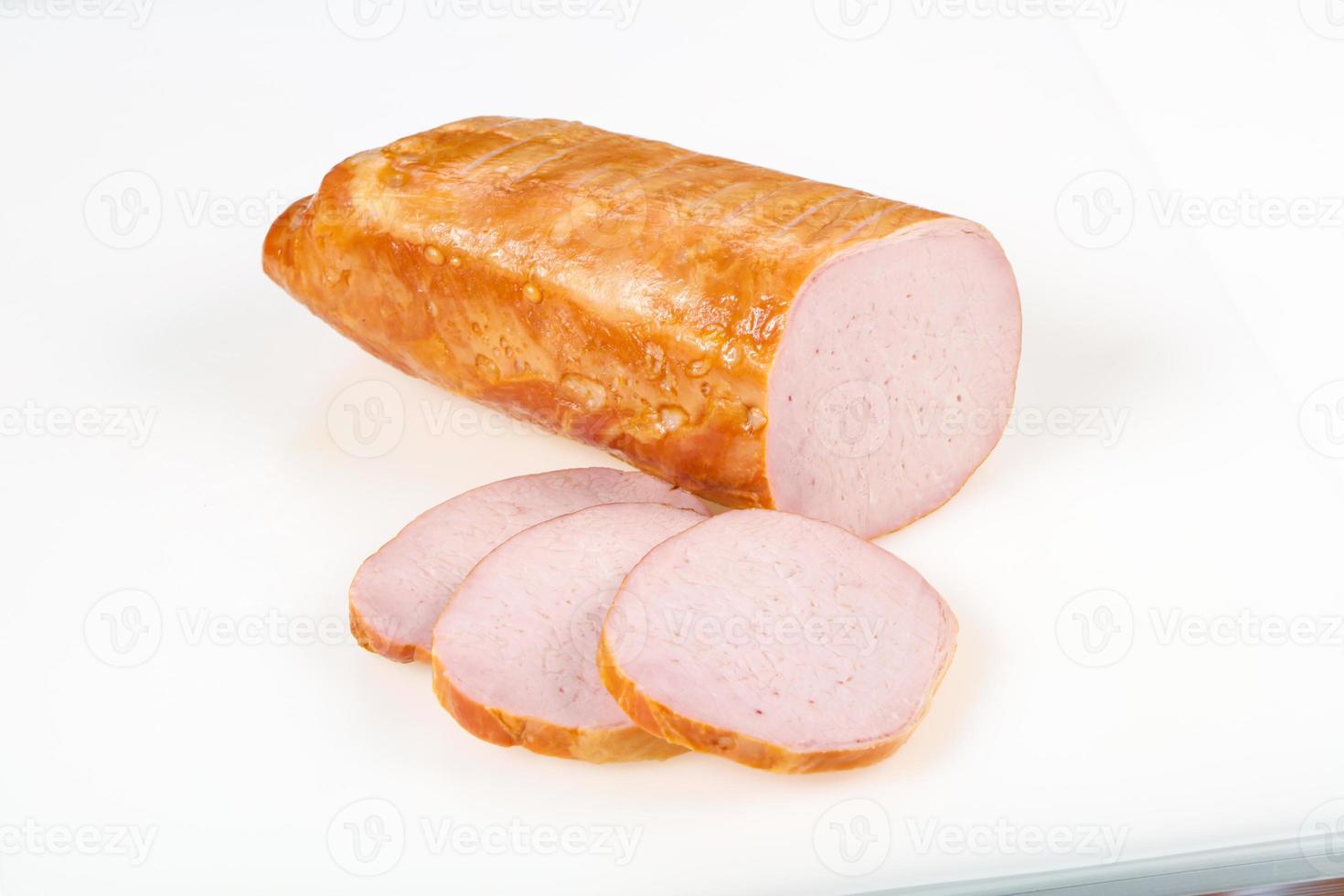 Tasty meat sausages over white background photo