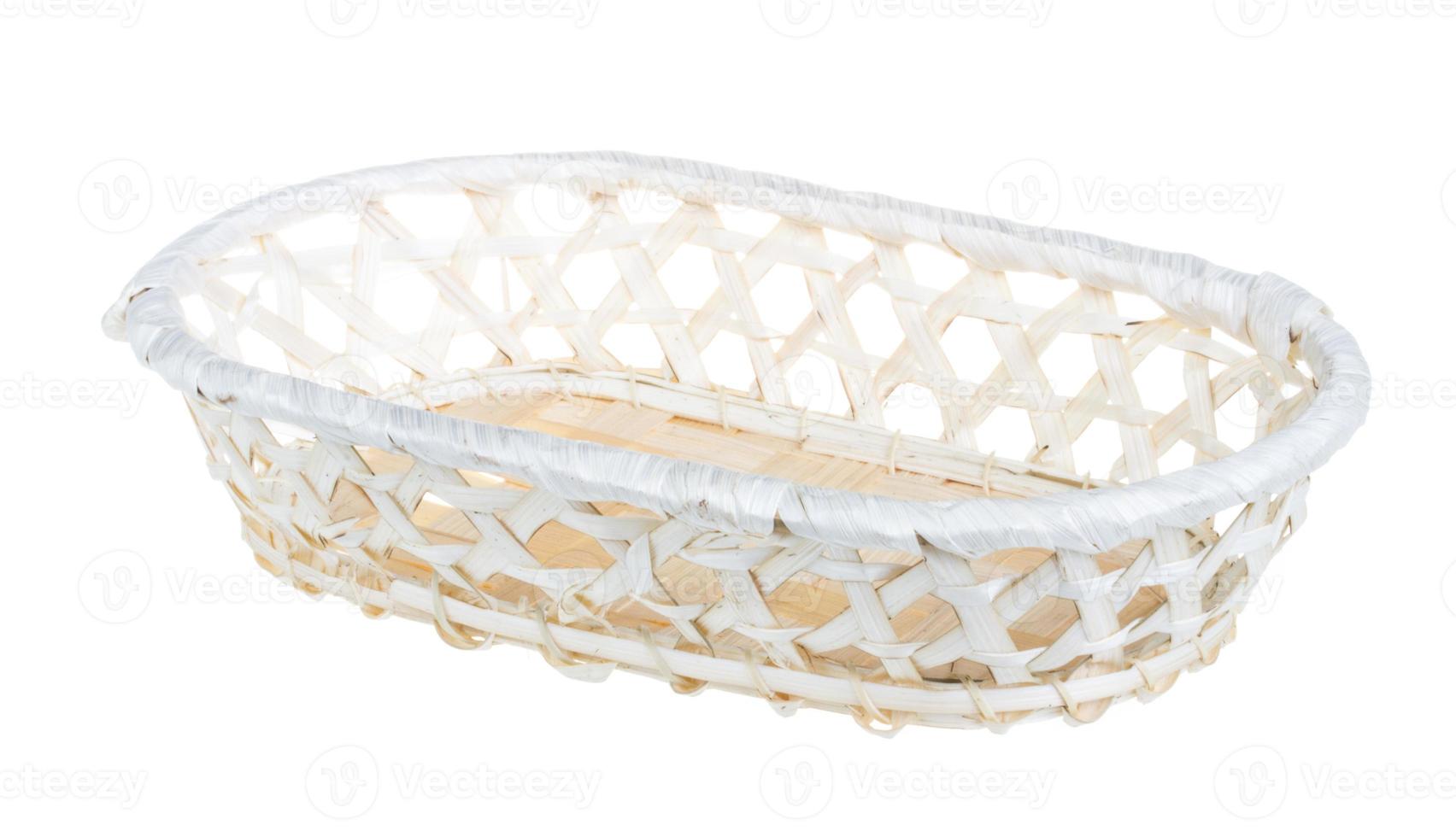 Wickerwork empty yellow breadbasket on white background photo