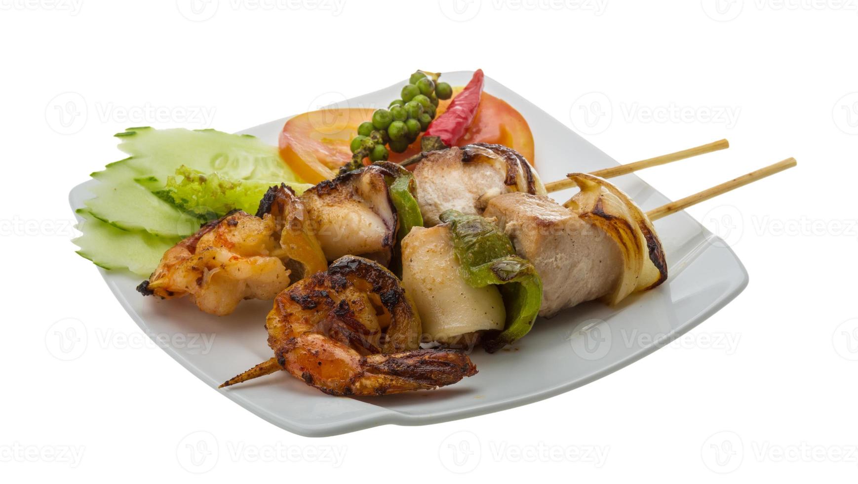 Seafood barbeque on white photo