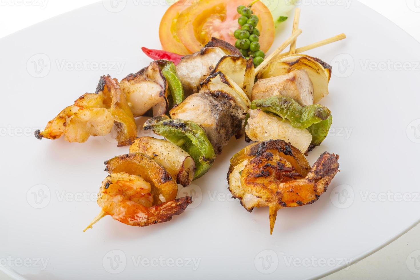 Seafood barbeque on white photo