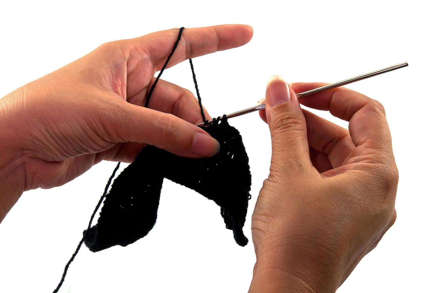 Women's hands doing crochet work photo