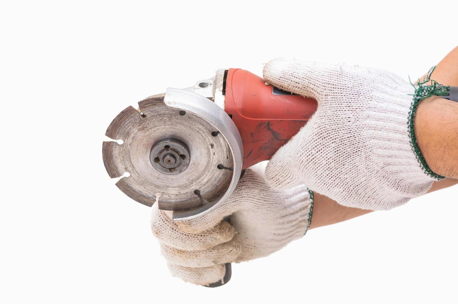 Worker is using angle grinder, hand tool, focus at blade and isolated over white. photo