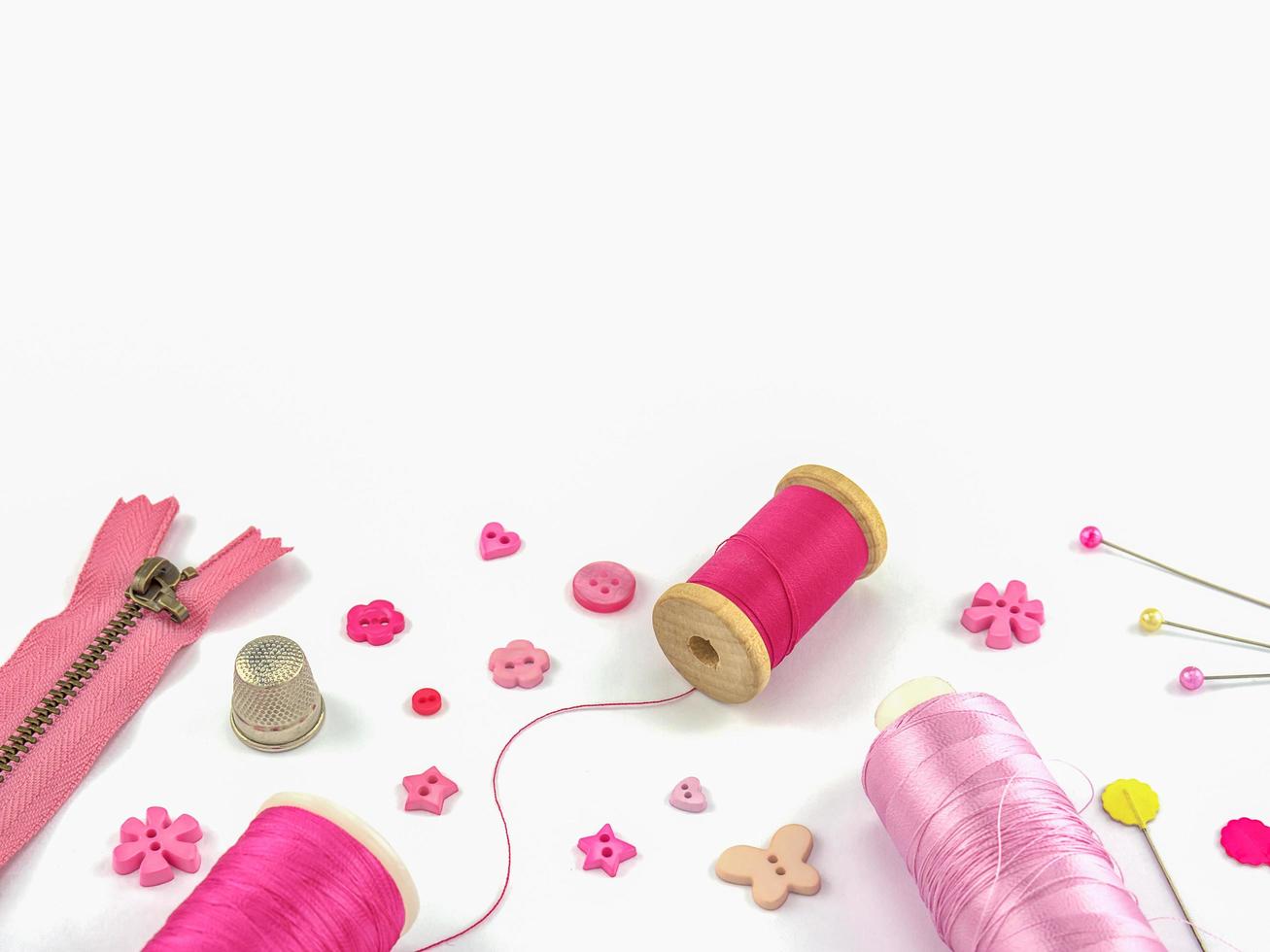 Pink embroidery set over white background photo