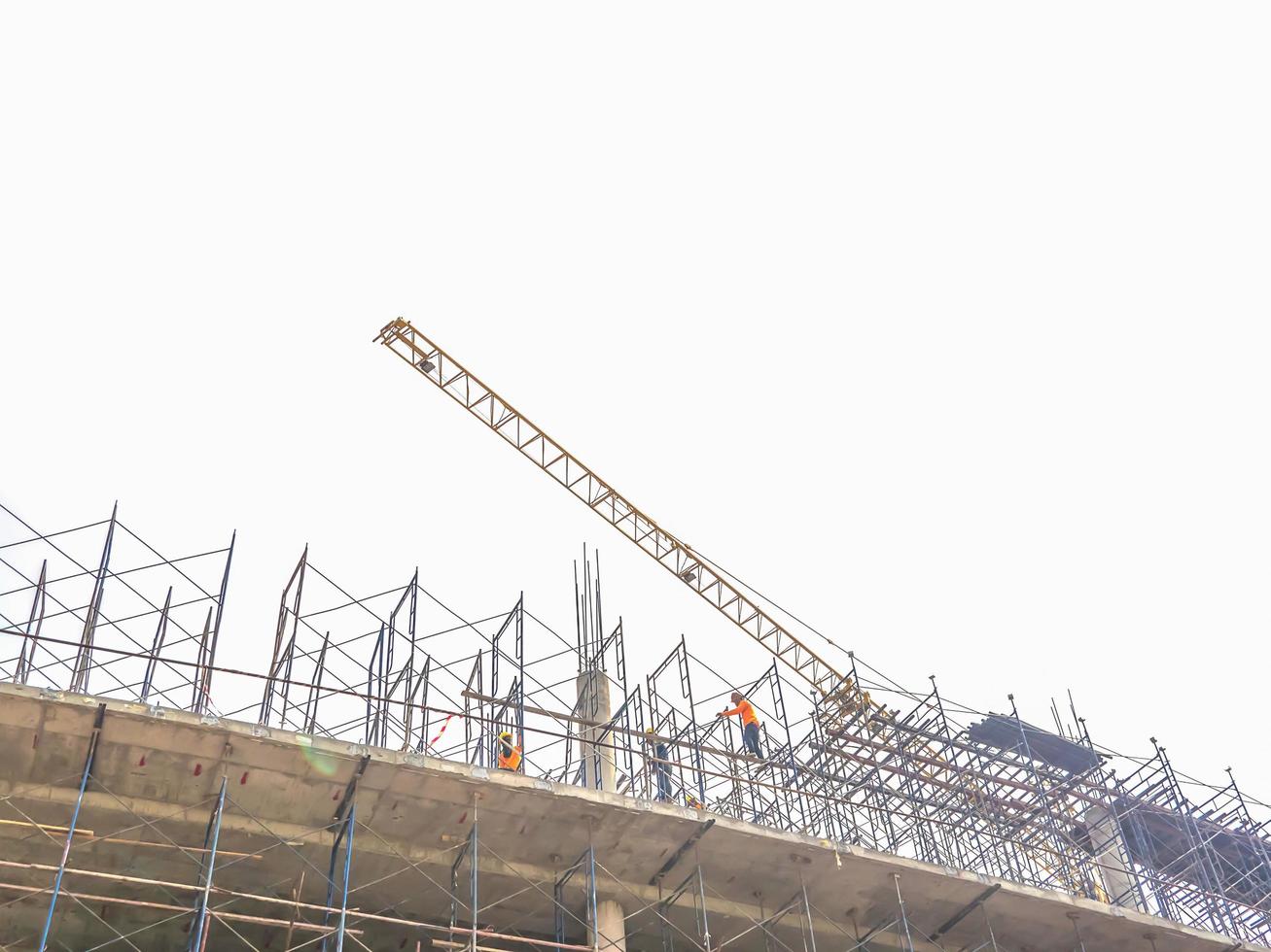 Soft focus of construction site with tower crane photo