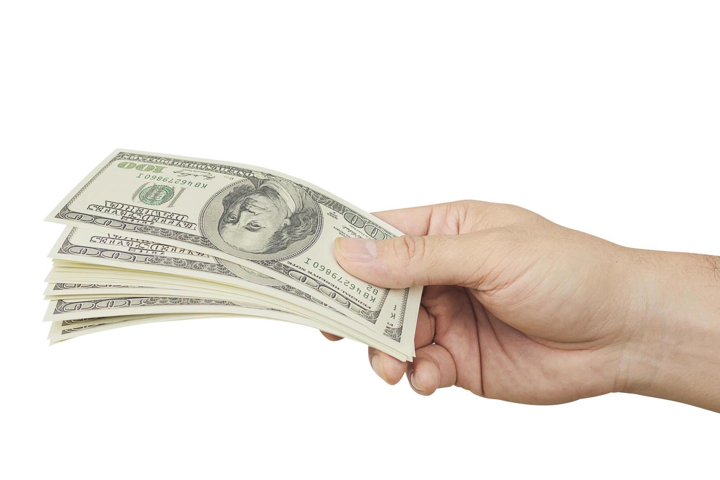 Hand giving out dollar bank note money isolated over white - photo includes CLIPPING PATH