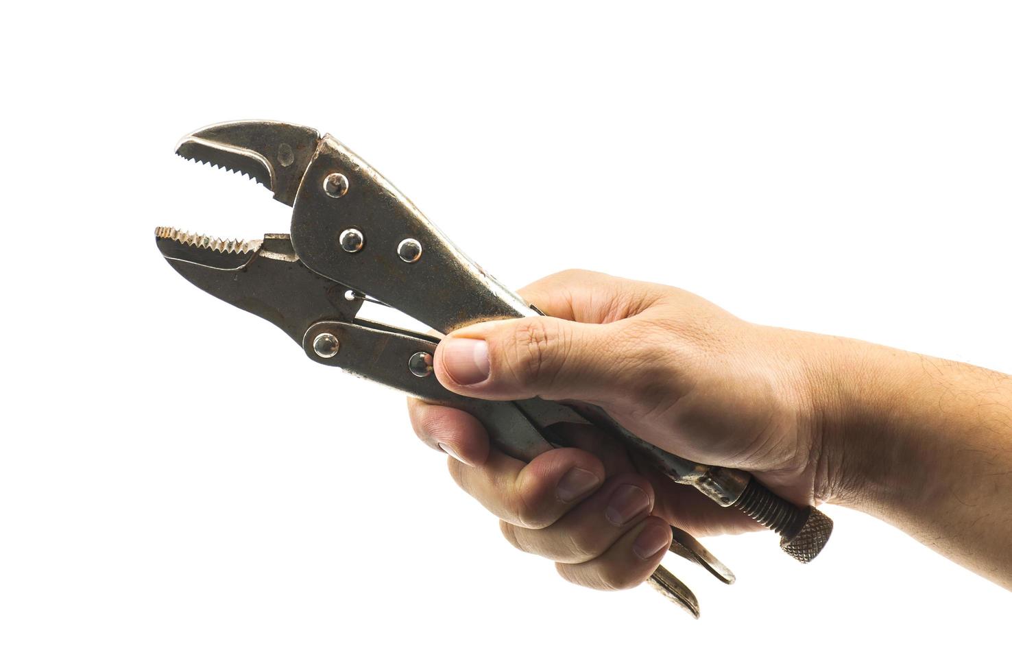 Man's hand holding locking pliers isolated over white photo