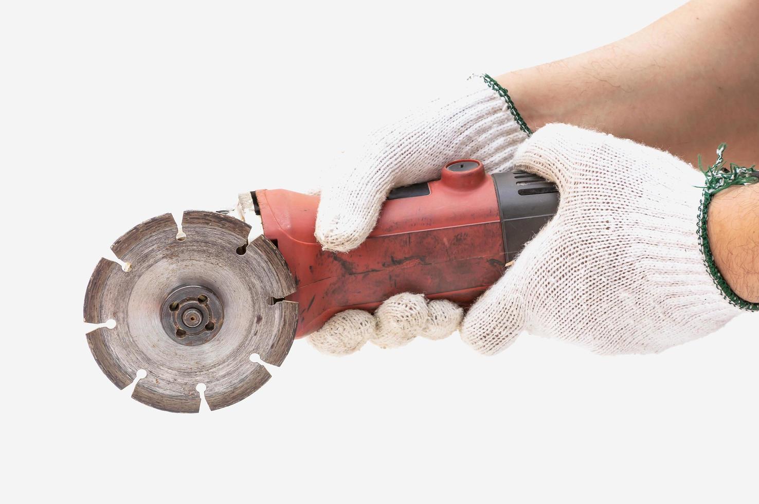 Worker is using angle grinder without cutting guard, wrong and dangerous using sample, focus at blade and isolated over white. photo