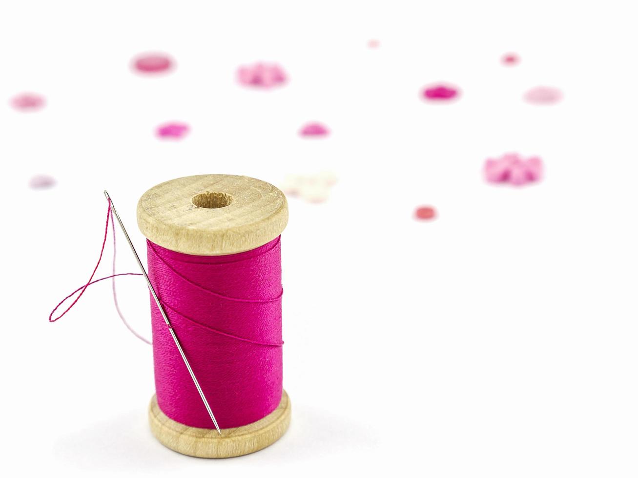 Pink embroidery set over white background photo