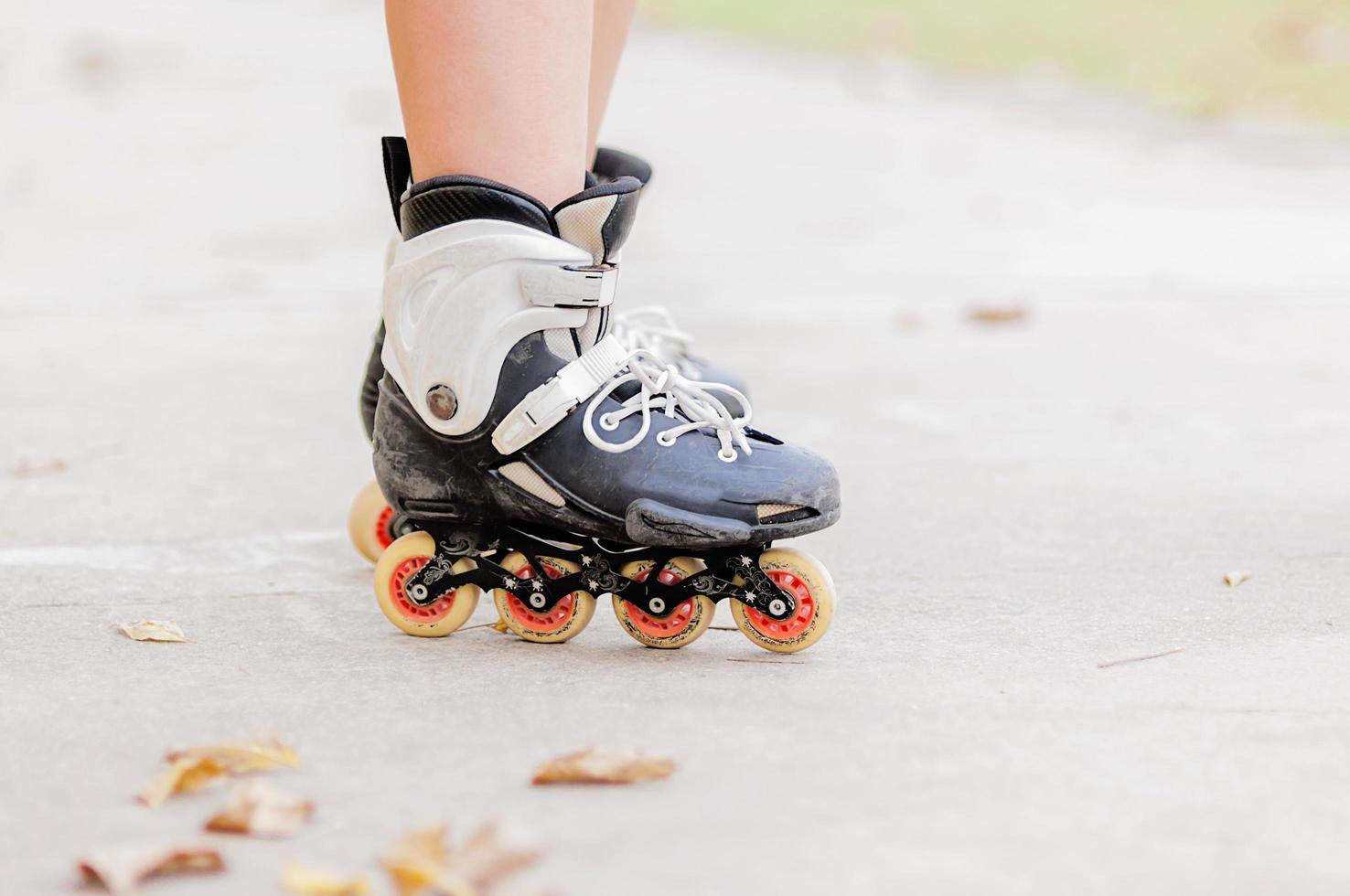 Closeup of boy is standing with roller blade, selective focused. photo