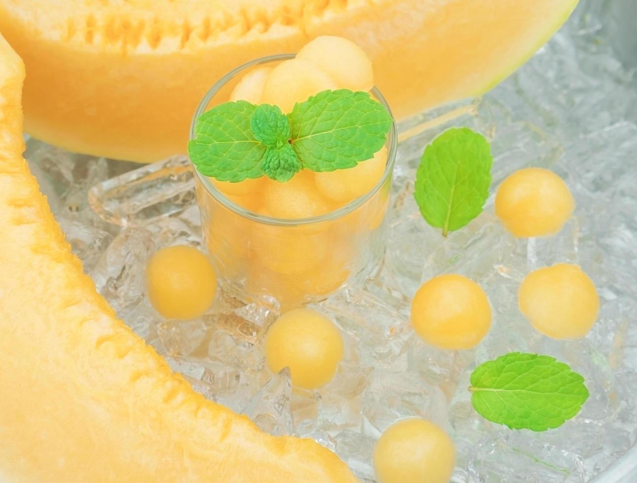 Cantaloupe with mint and ice decoration photo