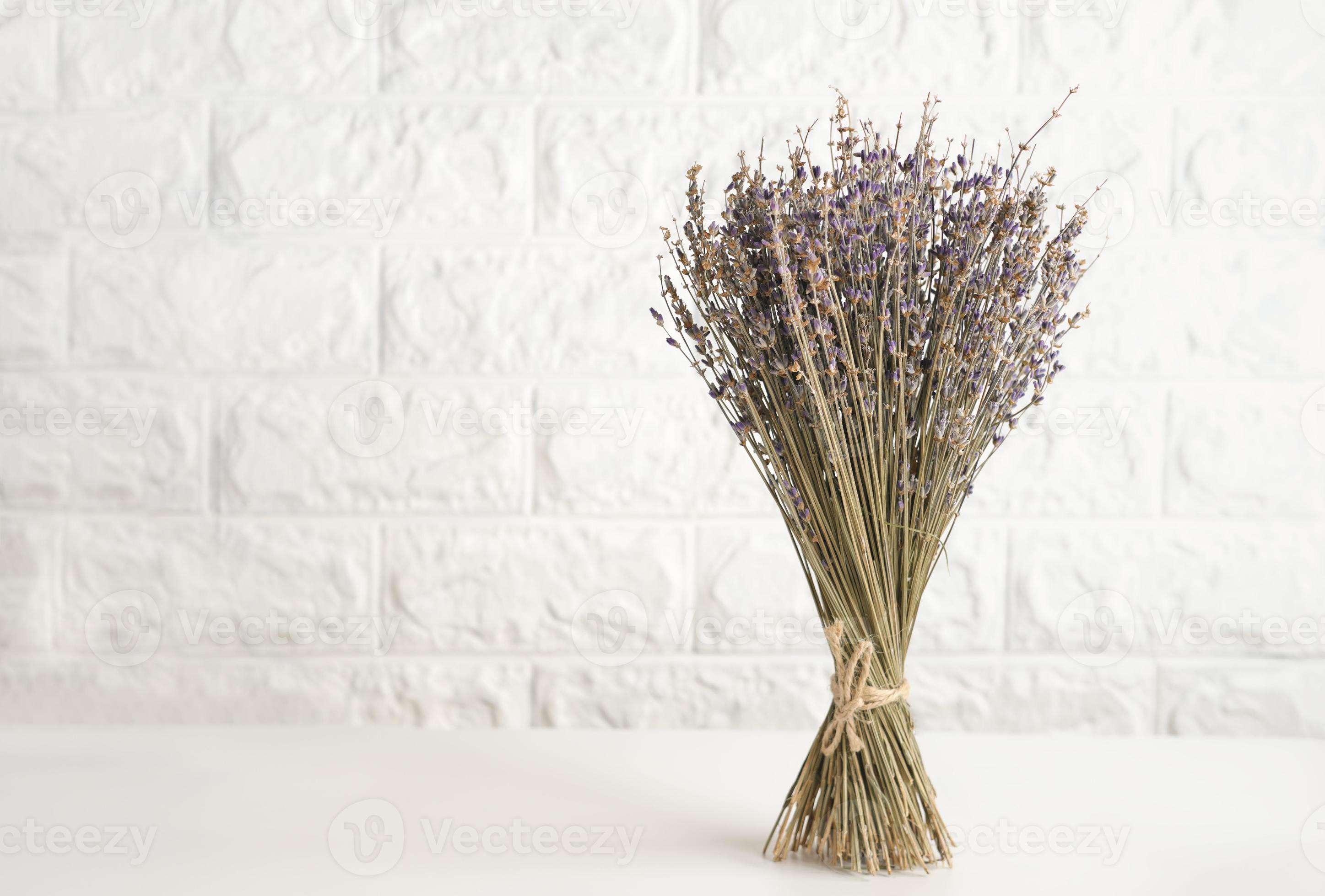 a bunch of dry lavender flowers on a kitchen table. 8417701 Stock Photo at  Vecteezy