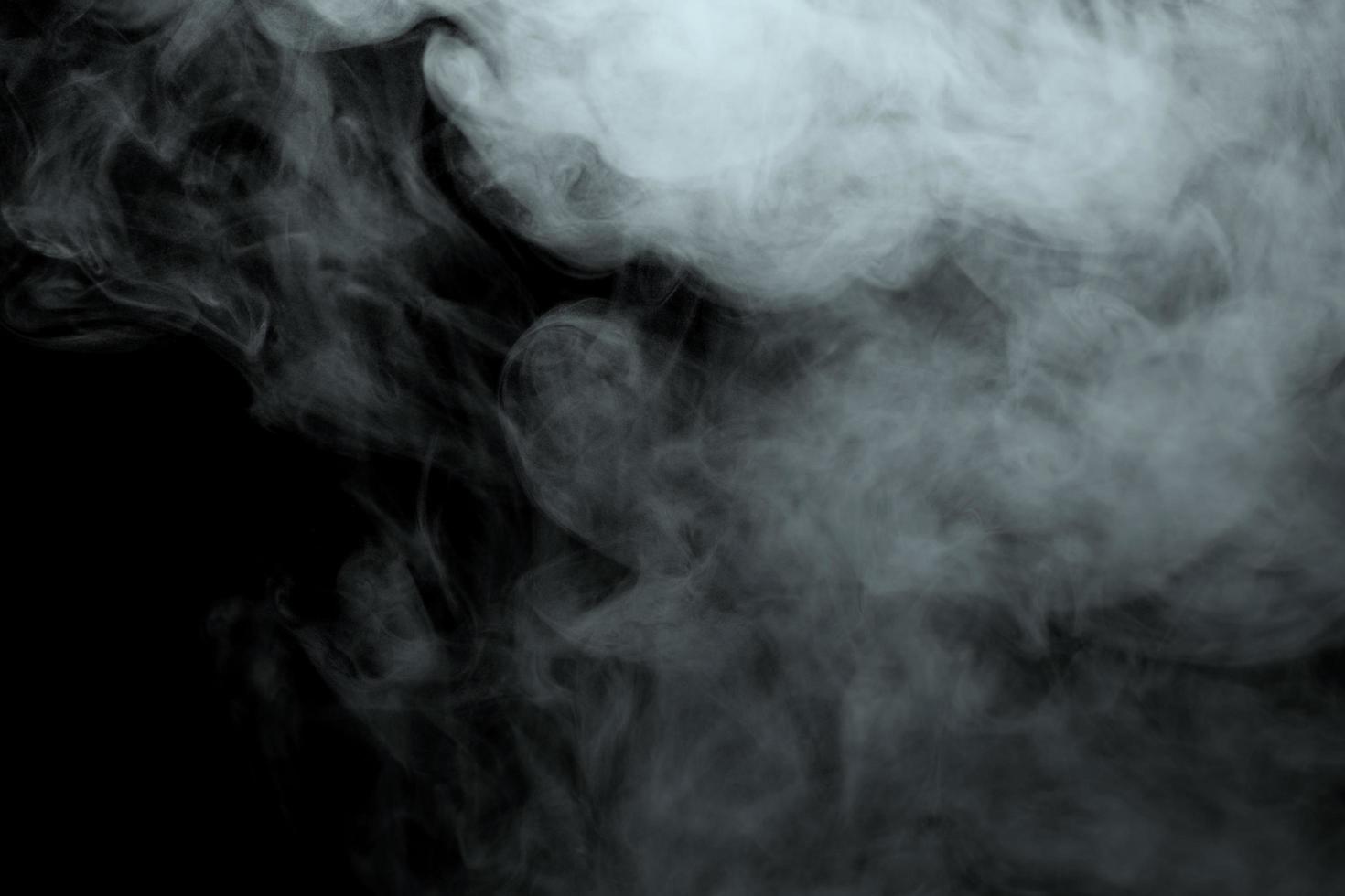 Abstract powder or smoke effect isolated on black background photo