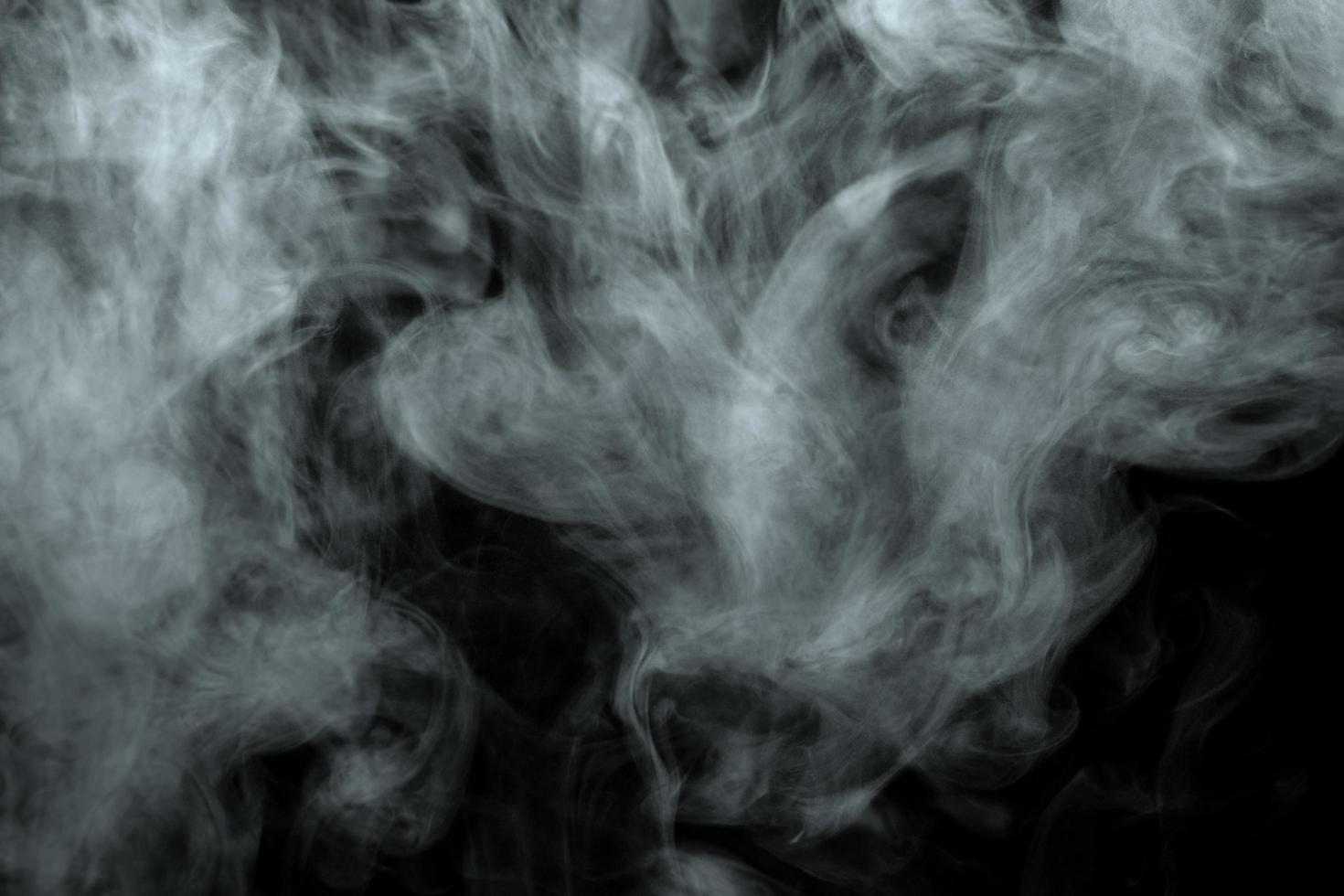 Abstract powder or smoke effect isolated on black background photo