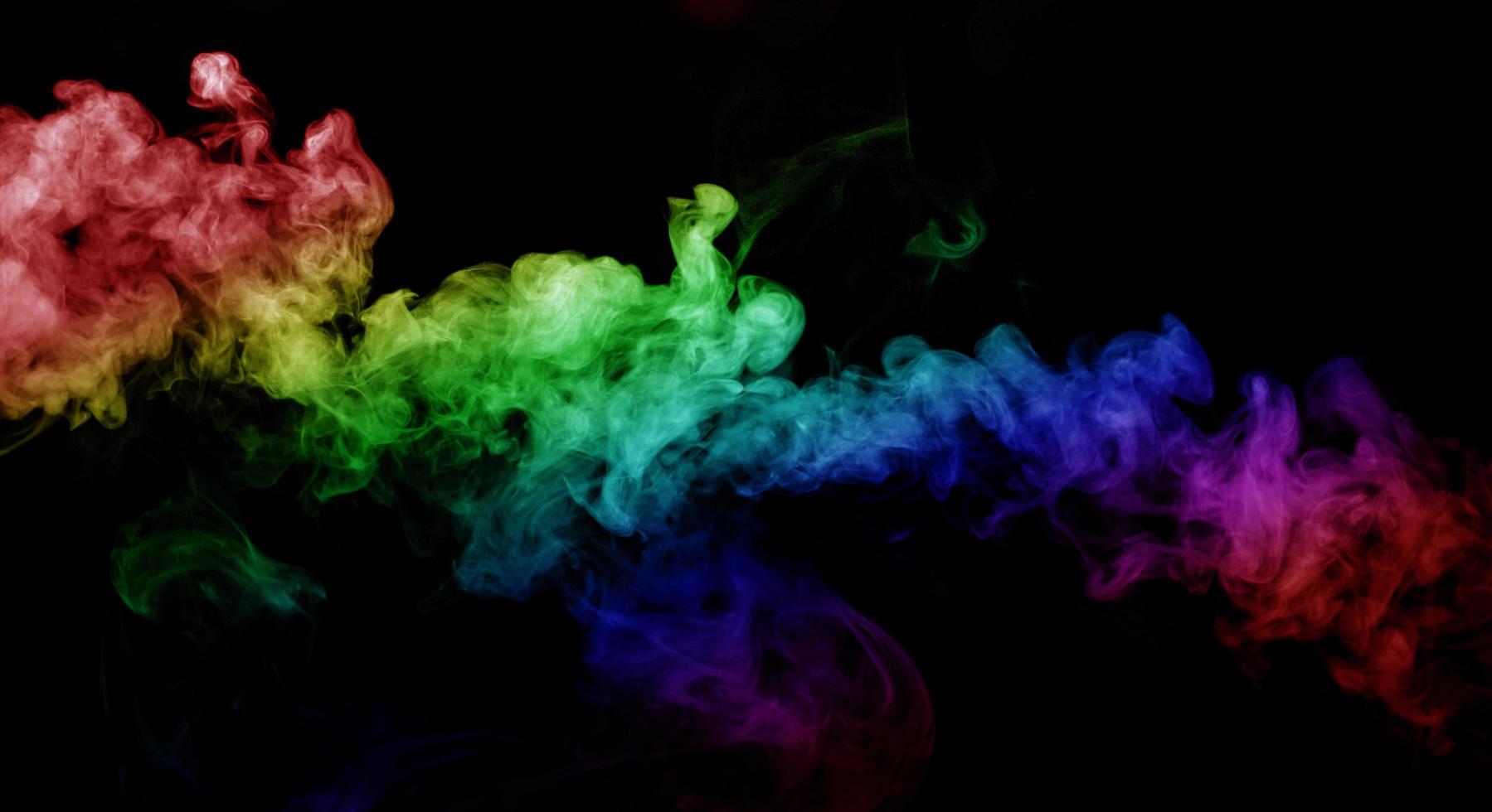 Abstract smoke isolated on black background,Rainbow powder photo