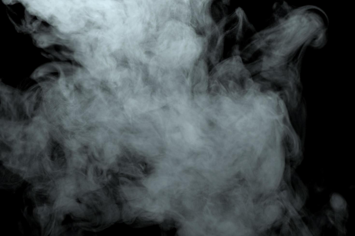 Abstract powder or smoke effect isolated on black background photo