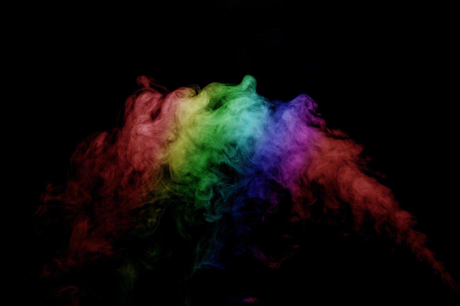 Abstract smoke isolated on black background,Rainbow powder photo