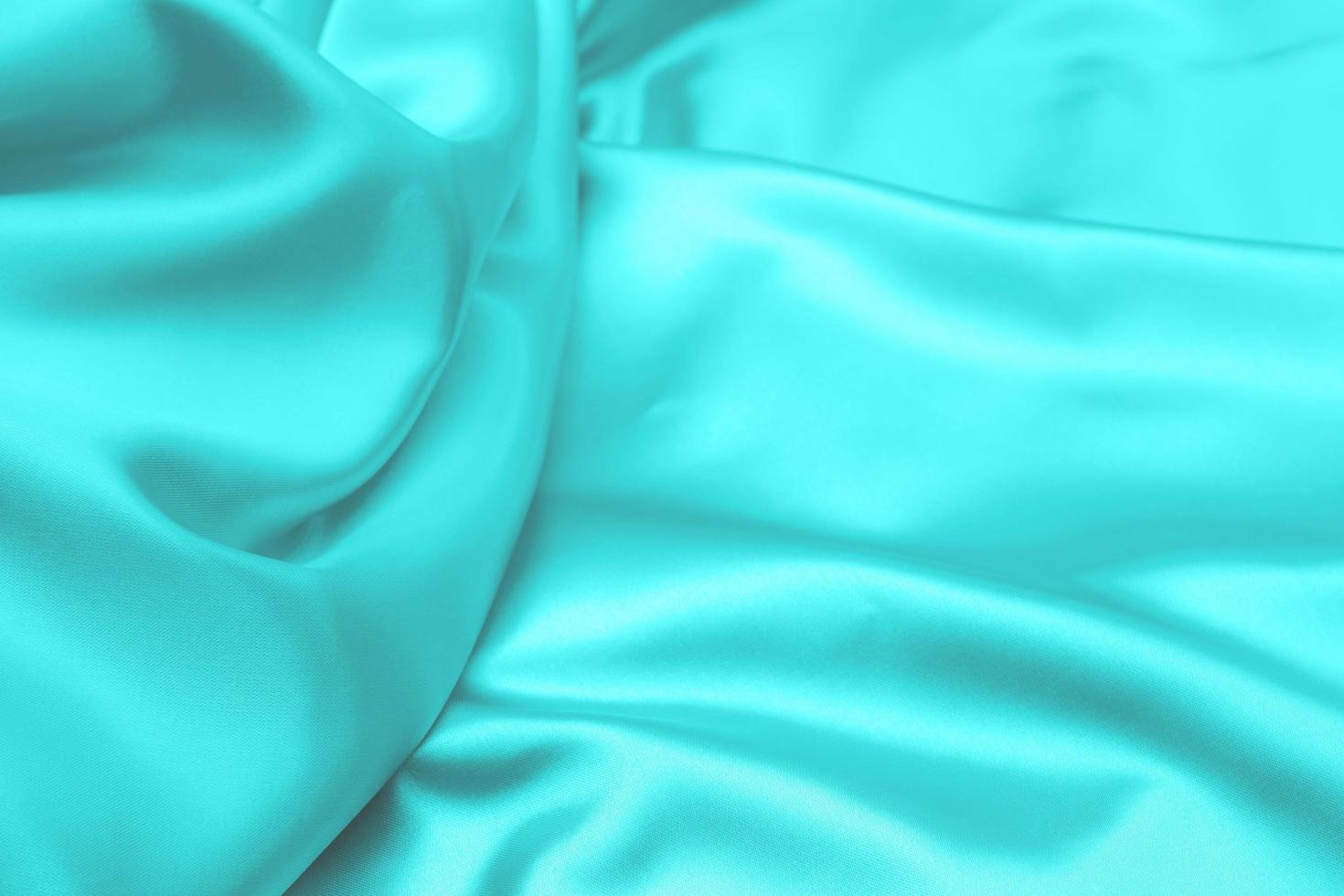 Cyan-Teal satin fabric texture soft background photo