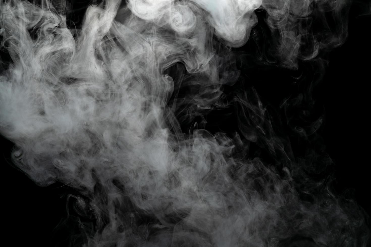 Abstract powder or smoke isolated on black background photo