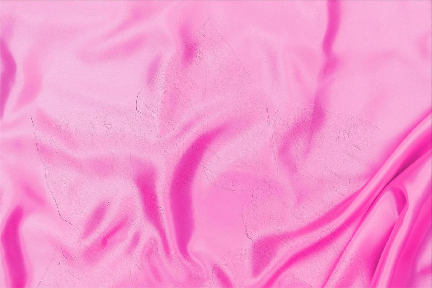 pink satin fabric texture soft blur with palm leaves pattern background photo