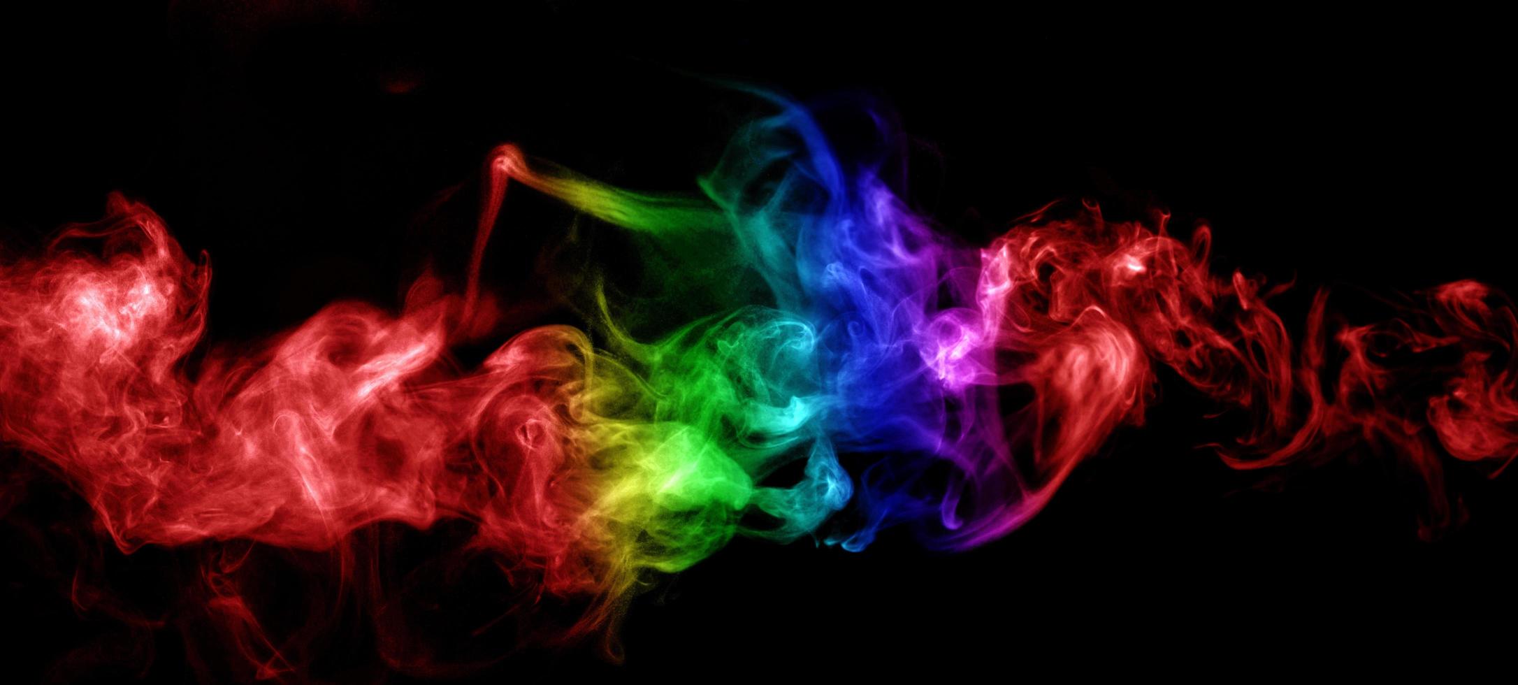 Abstract smoke isolated on black background,Rainbow powder photo