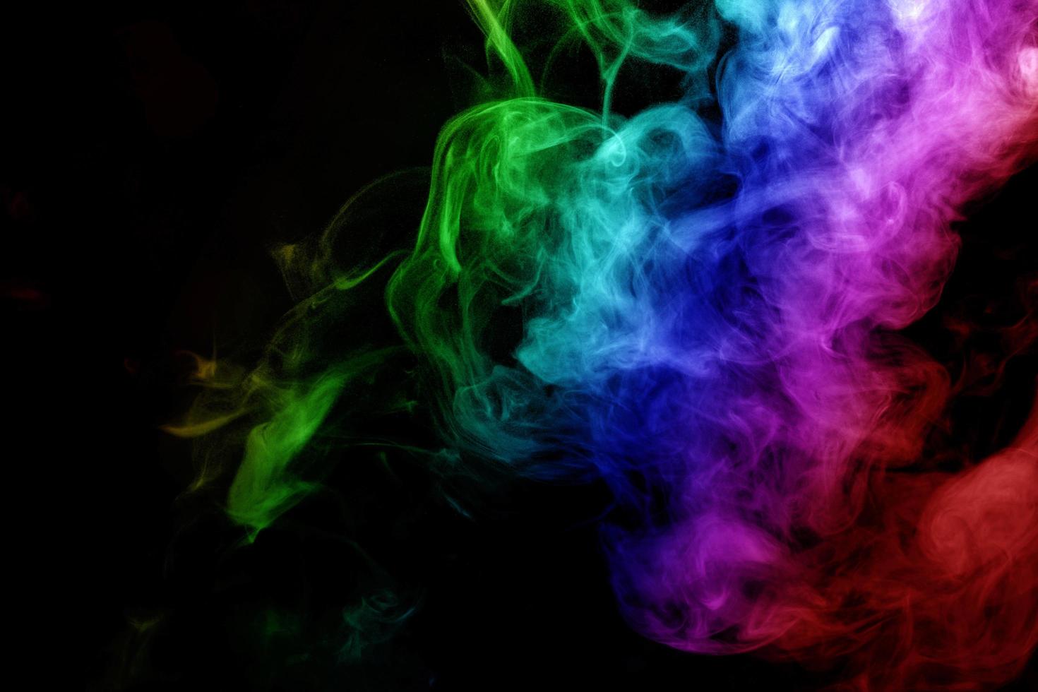 Abstract smoke isolated on black background,Rainbow powder photo