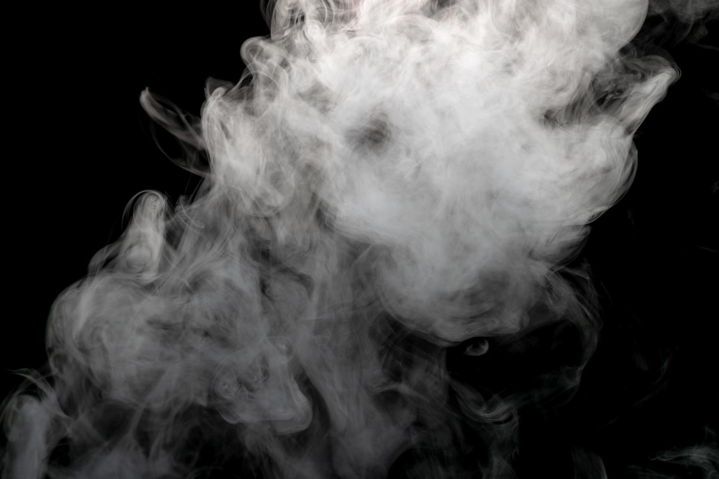 Abstract powder or smoke isolated on black background photo