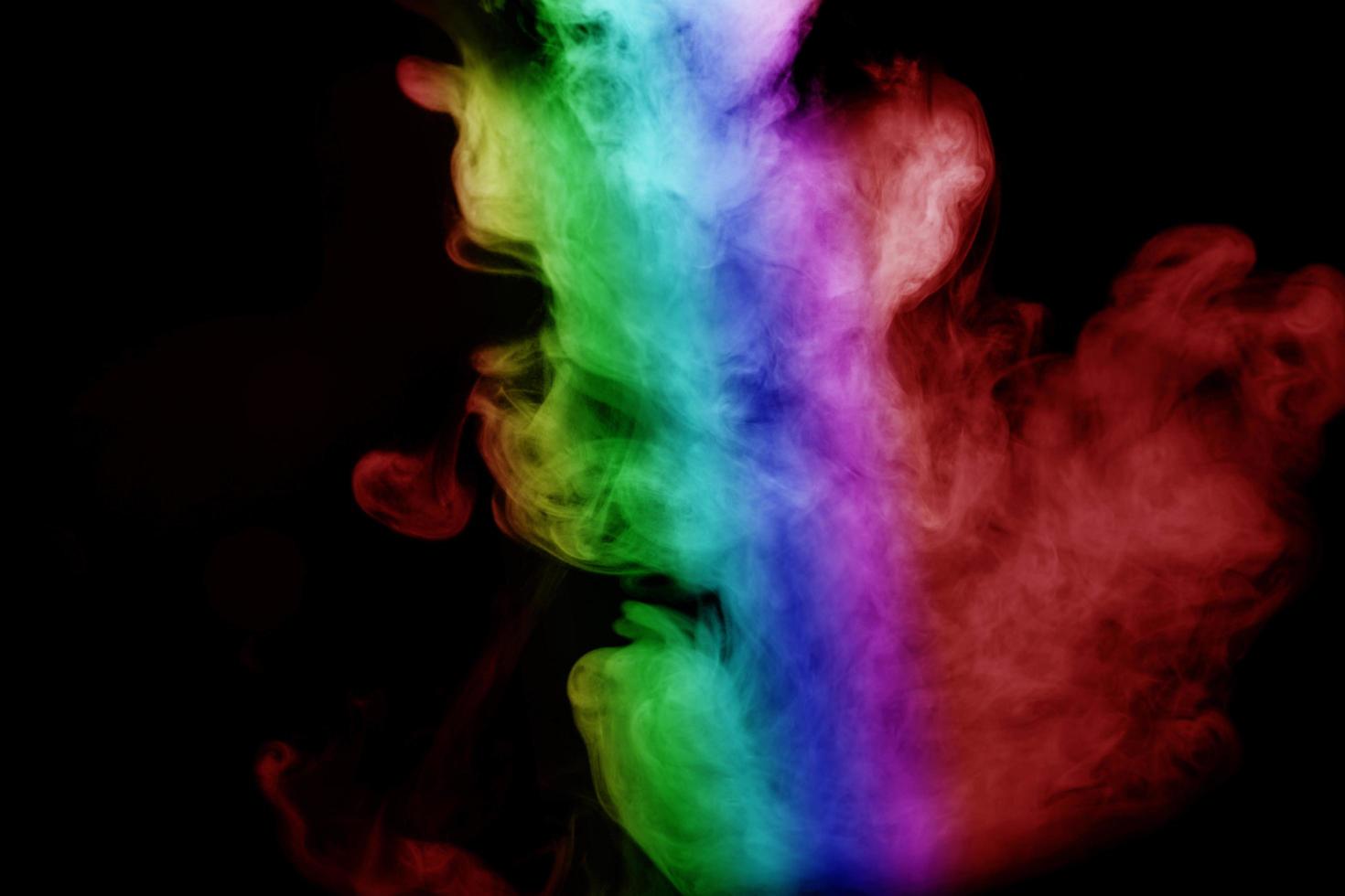 Abstract smoke isolated on black background,Rainbow powder photo