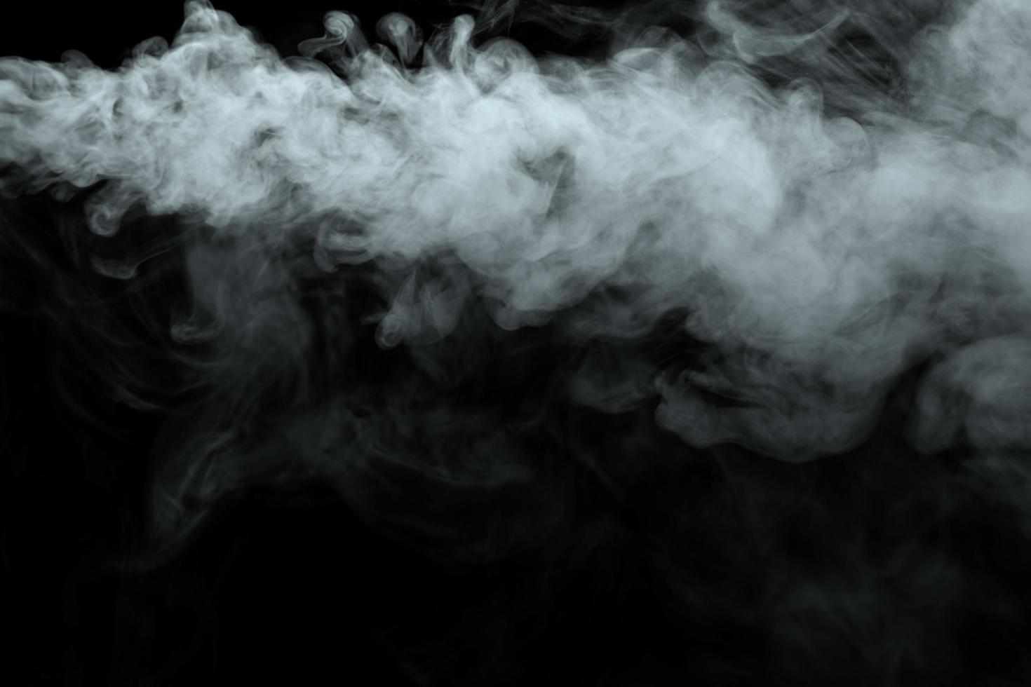 Abstract powder or smoke effect isolated on black background photo