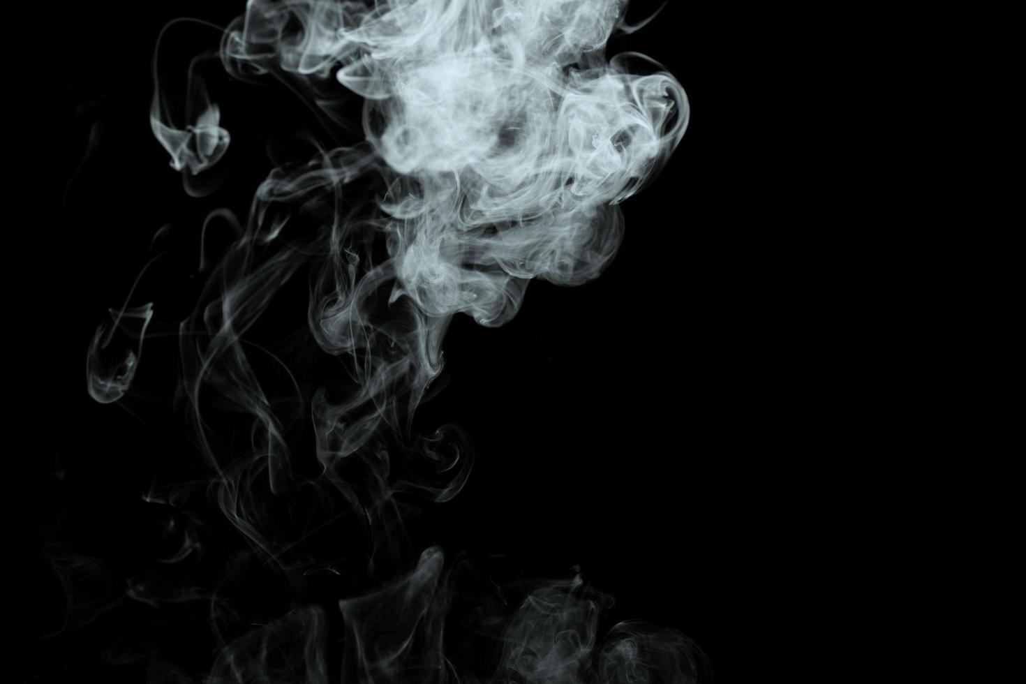 Abstract powder or smoke effect isolated on black background photo