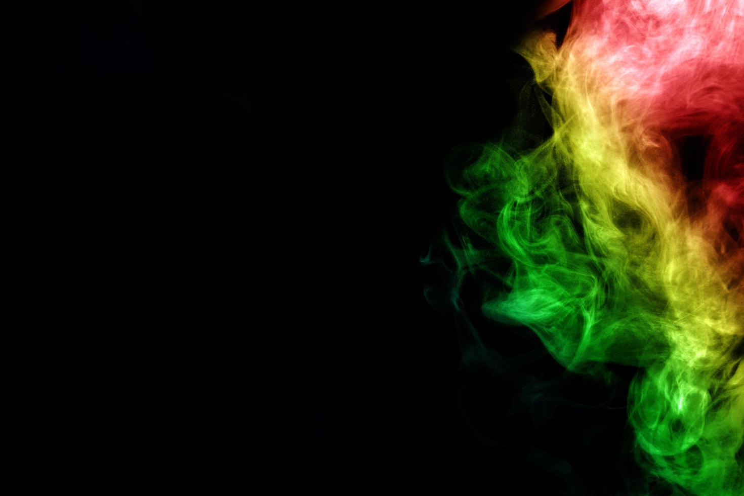 Abstract smoke isolated on black background,Rainbow powder photo