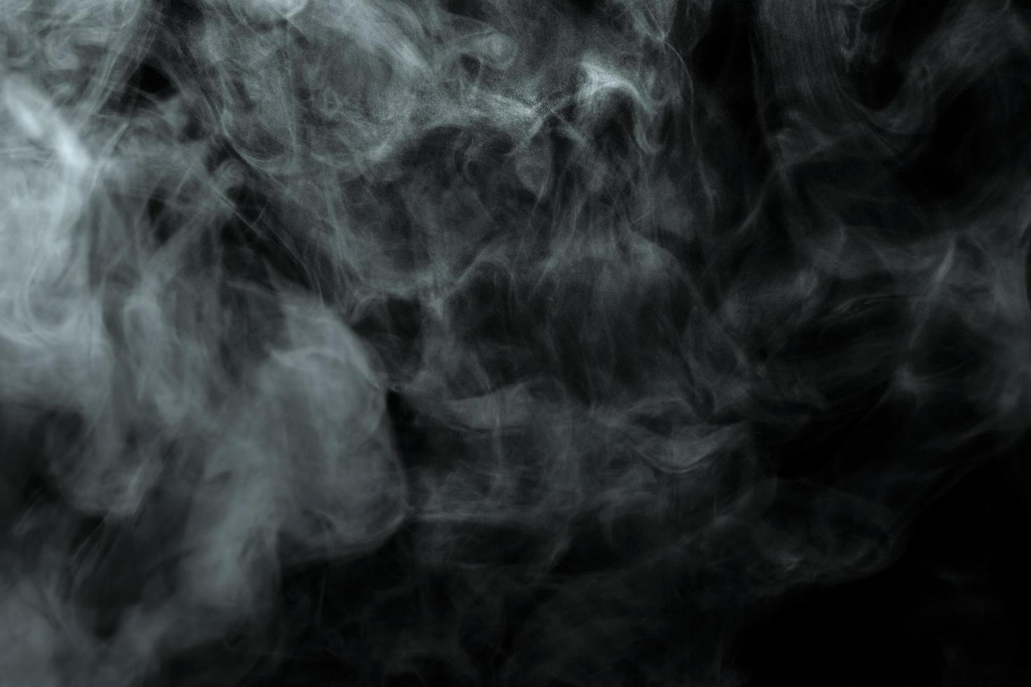 Abstract powder or smoke effect isolated on black background photo