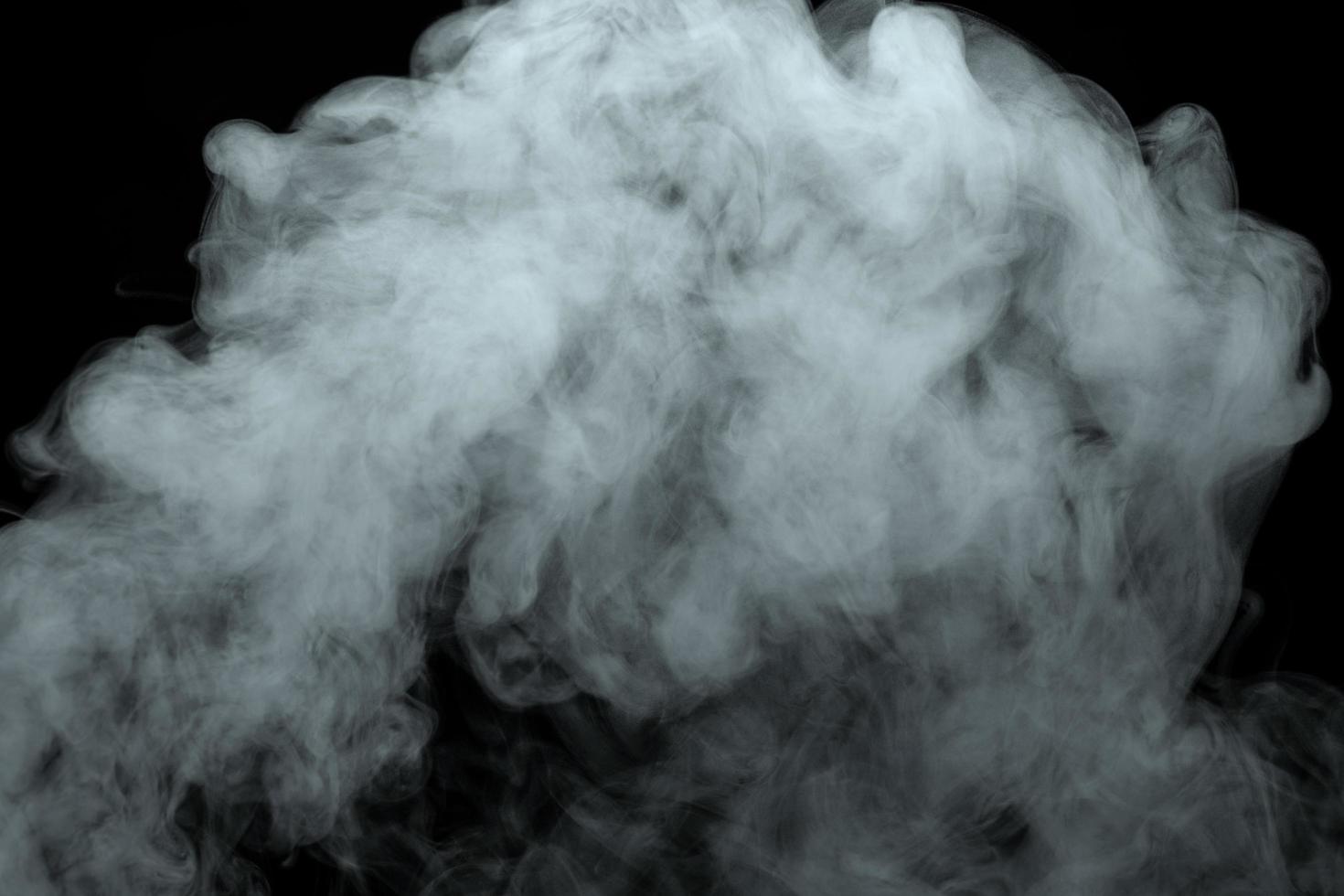Abstract powder or smoke effect isolated on black background photo