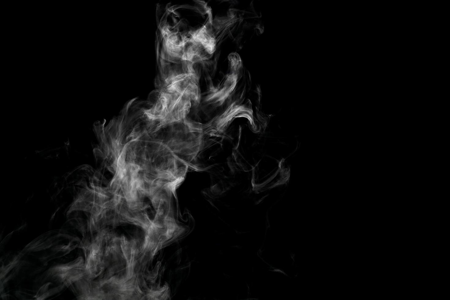 Abstract powder or smoke isolated on black background photo