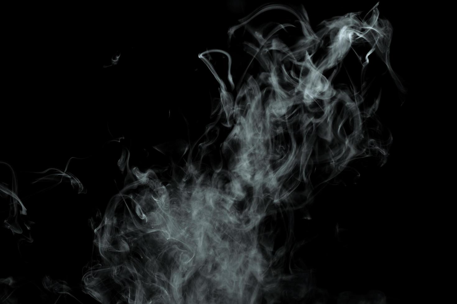 Abstract powder or smoke effect isolated on black background photo