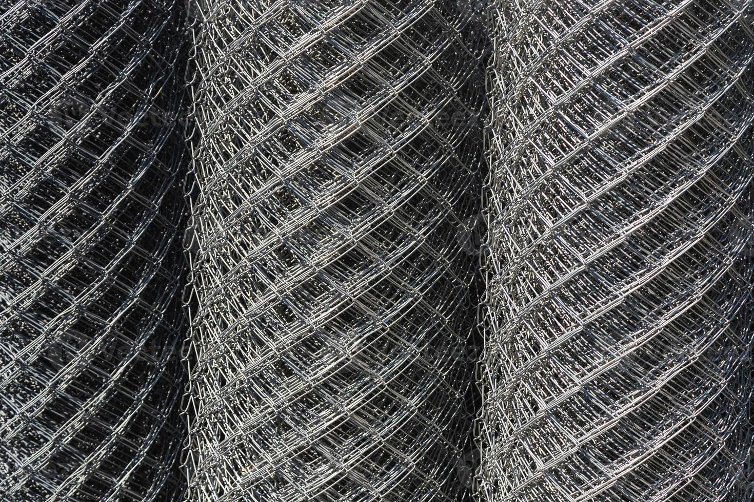 Chrome grille 3D detail for building. Close up pattern of a furnace filter. Black and white close up of a sidewalk subway grate with shallow depth of field. photo