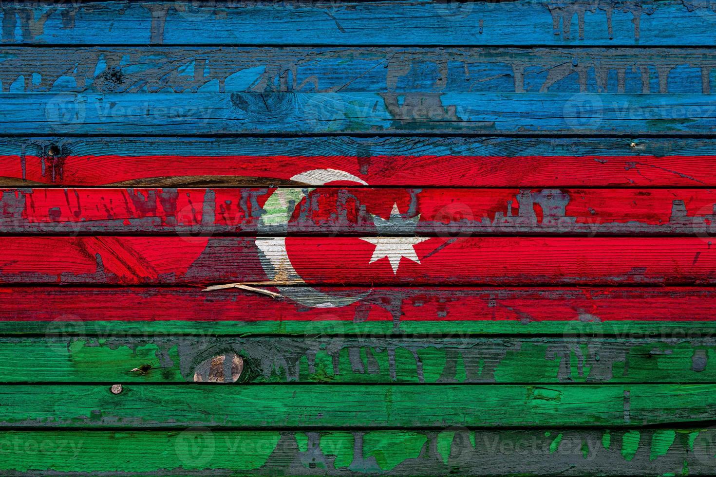 The national flag of Azerbaijan is painted on uneven boards. Country symbol. photo