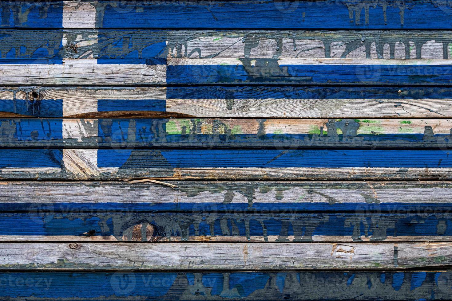 The national flag of Greece is painted on uneven boards. Country symbol. photo