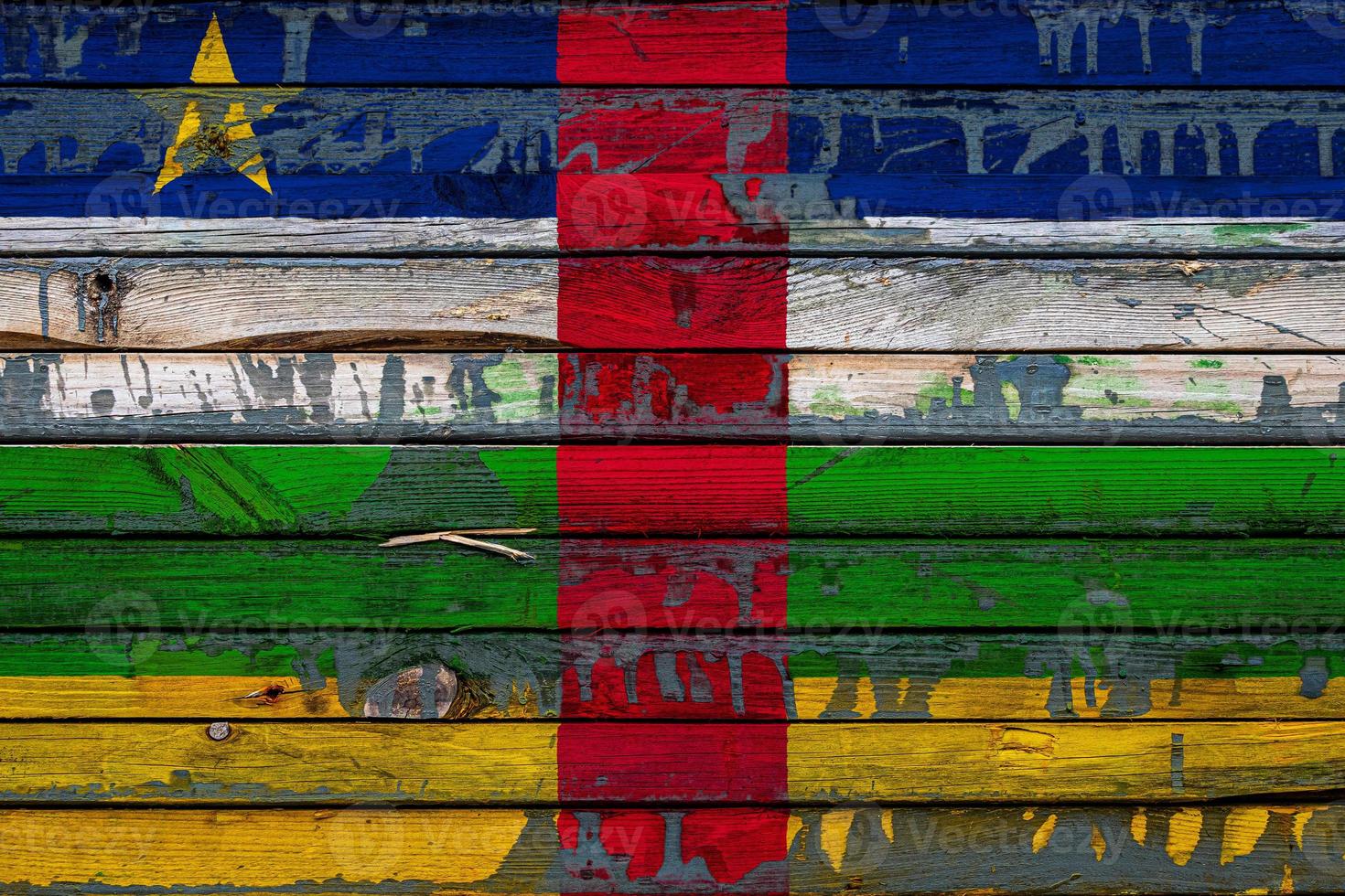 The national flag of Central African Republic is painted on uneven boards. Country symbol. photo
