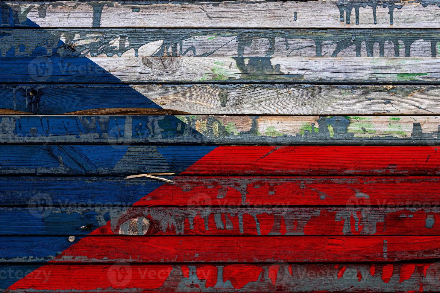 The national flag of Czech  is painted on uneven boards. Country symbol. photo