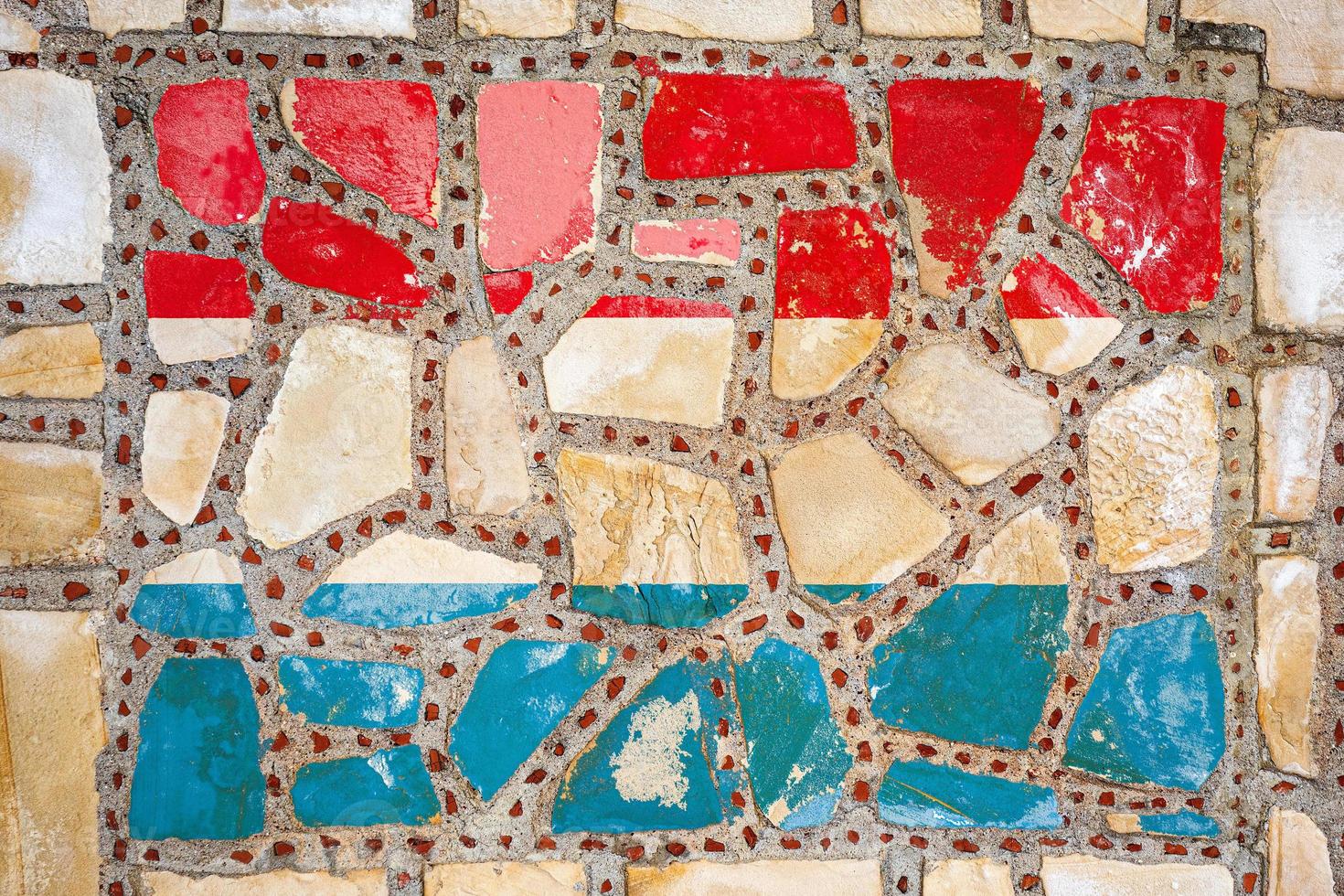 National flag of  Luxembourg  on stone  wall background. Flag  banner on  stone texture background. photo