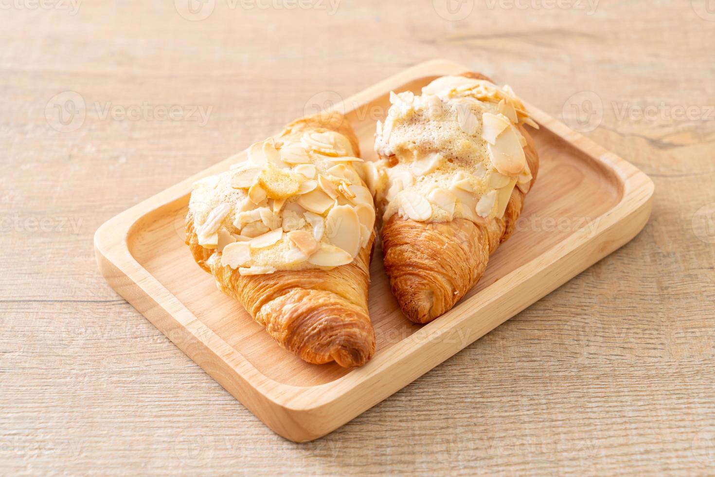 croissant with cream and almonds photo