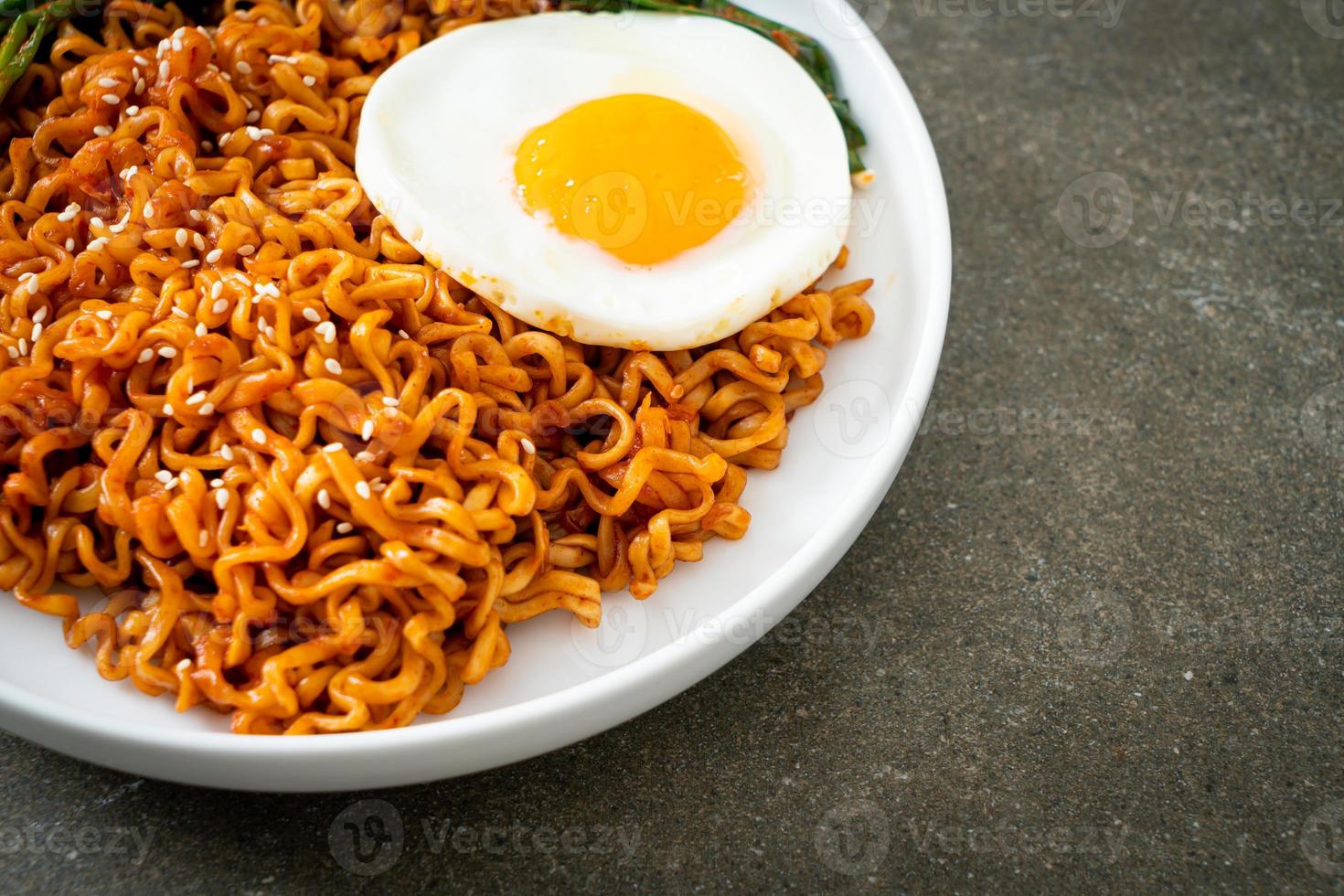 dried Korean spicy instant noodles with fried egg photo