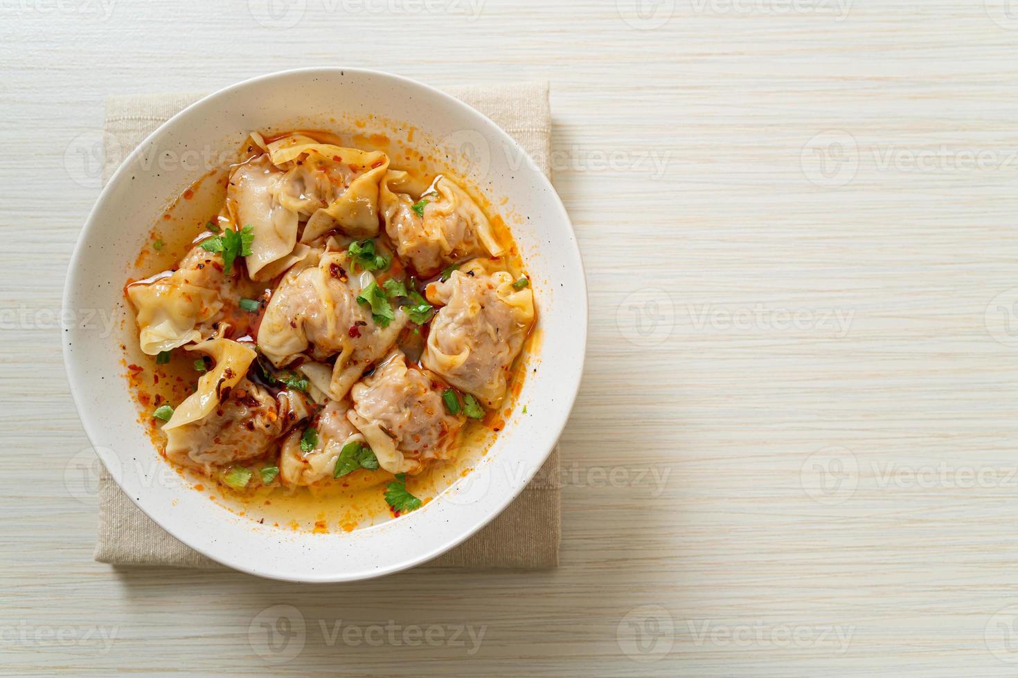 pork wonton soup or pork dumplings soup with roasted chili photo