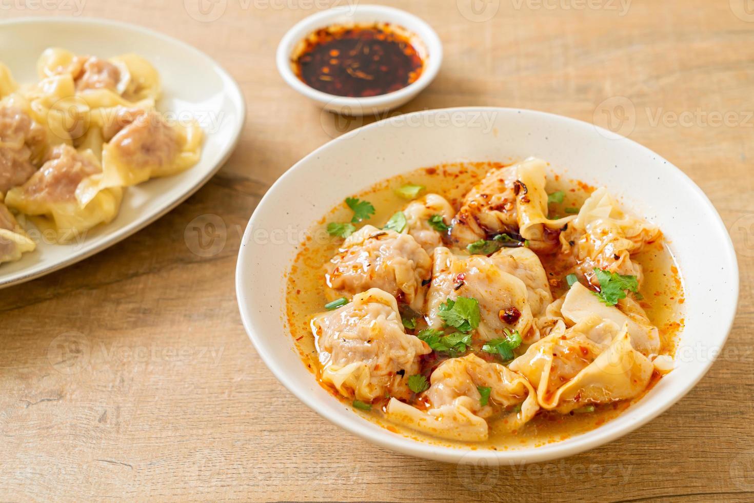 pork wonton soup or pork dumplings soup with roasted chili photo