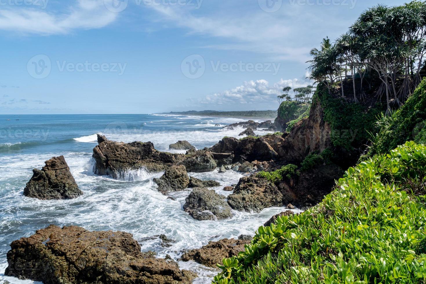 Natural view of the coast in Indonesia when the weather is sunny. Karang Tawulan beach tourism in Indonesia photo